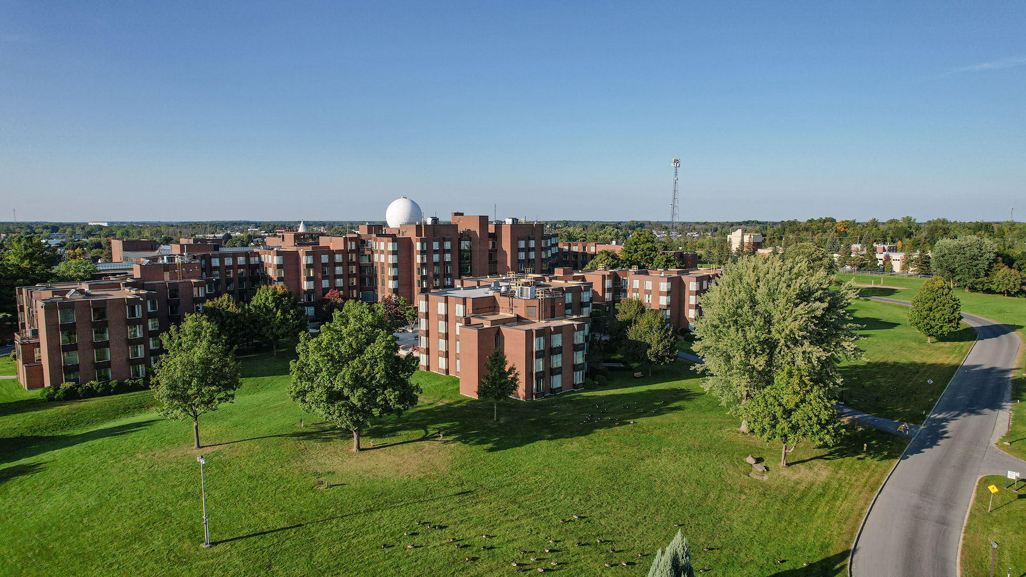 Aerial view of DEV Hotel beside the St. Lawrence River